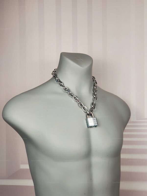 Close-up of silver Chain Collar with Padlock, displayed on marble background