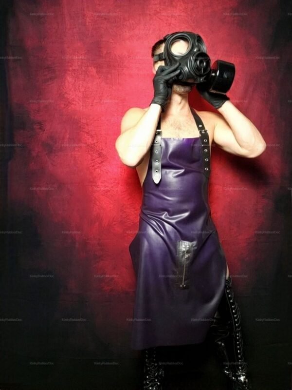 Dark purple rubber apron with metallic zip and adjustable straps against a red background.