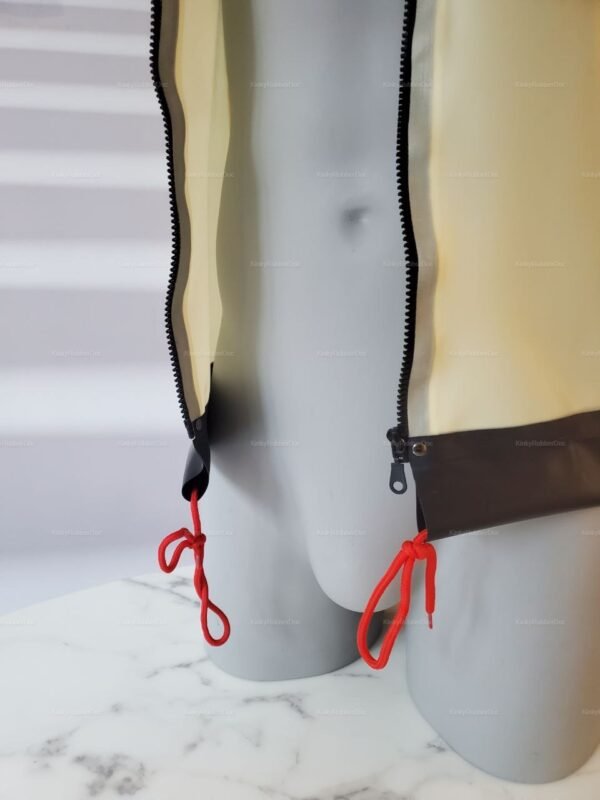 Semi-transparent white latex jacket with black zippers and red ties, set against a neutral background.