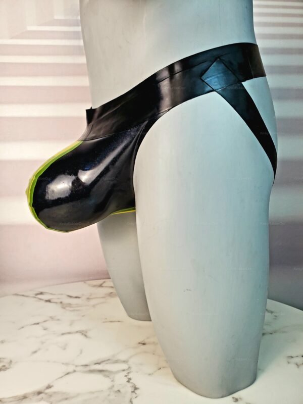 Shiny black latex jockstrap with red accents, designed for a bold and edgy look.
