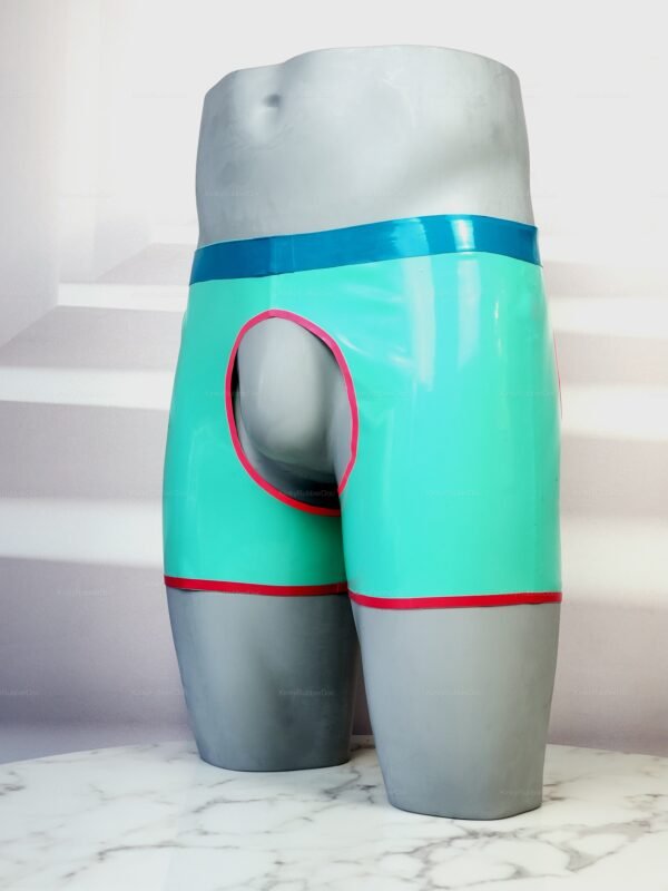 Kinky latex chaps short in aqua with bold blue and red accents featuring open front and back design.