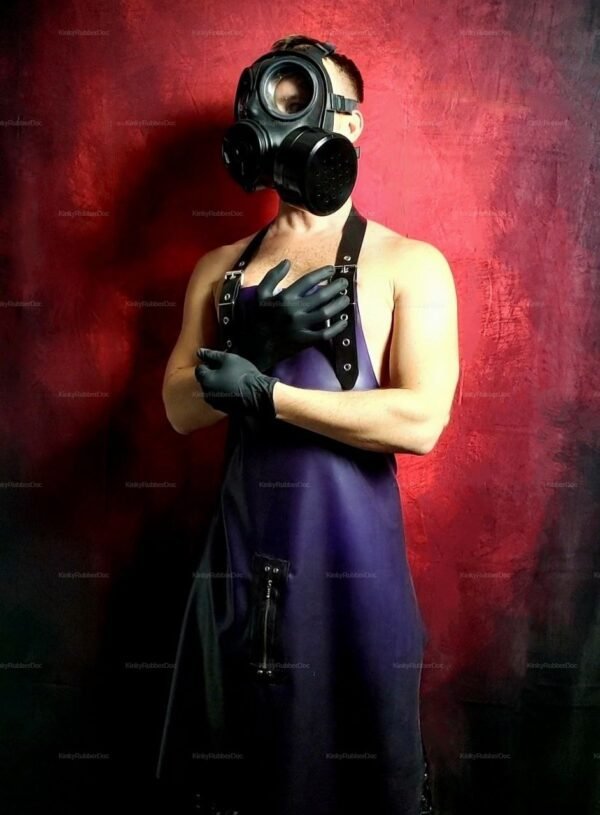 **Alt Text**: Kinky latex apron with gas mask and gloves against a red backdrop.