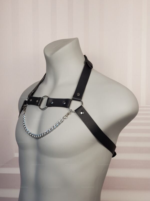 Close-up of black faux leather Chain Chest Harness detail on a mannequin, designed for pride events, clubwear, or fetish fashion