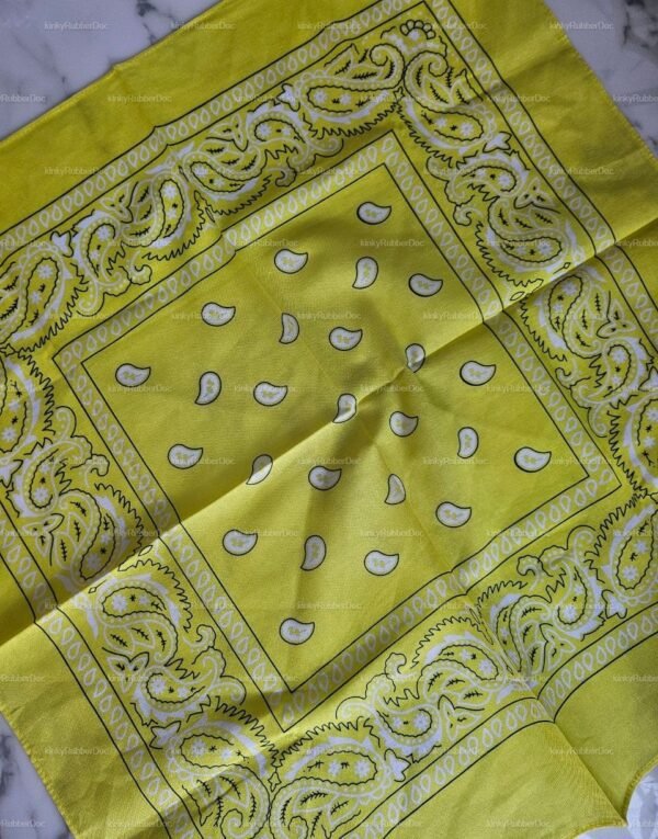 Bright yellow handkerchief with paisley patterns for a bold fashion statement.