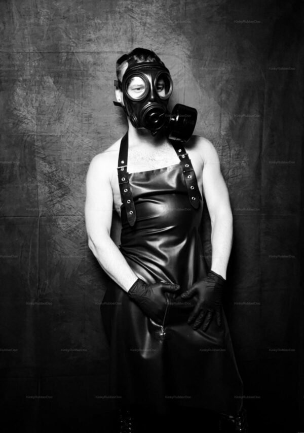 **Alt Text**: Black latex apron with zipper front, paired with a gas mask and gloves, for a bold fetish fashion statement.