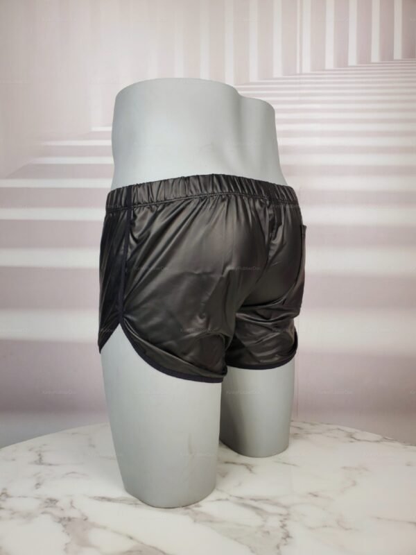 Sleek black faux leather shorts with a glossy finish.