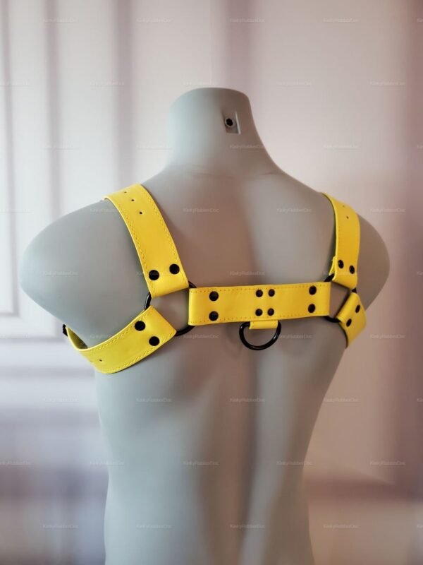 Vibrant yellow leather-look chest harness with adjustable straps and metal ring accents.