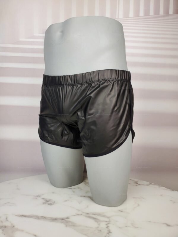 Sleek faux leather men's shorts with a minimalist design, featuring a glossy black finish and elastic waistband.