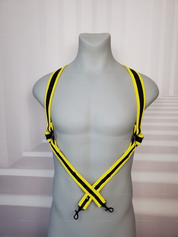 Yellow and black neoprene harness with adjustable straps and metal ring accents.