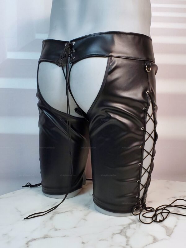 Open-back faux leather chap shorts with laced sides and a sleek finish.