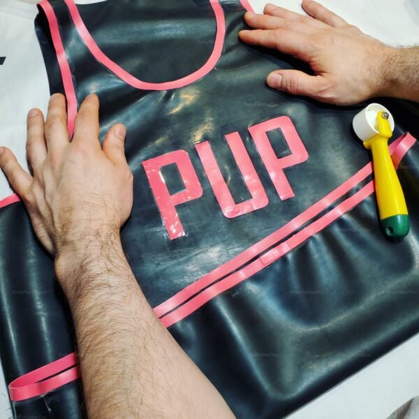 Black latex tank top with pink accents and "PUP" lettering, designed for a bold and playful look.