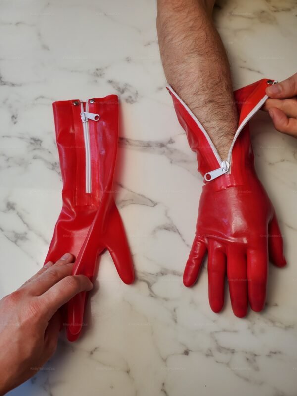 Red Latex Zipper Gloves on a marble surface, highlighting their shiny finish and sleek design.