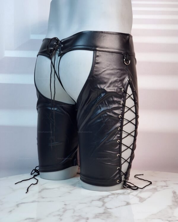 Black leather-look chap shorts with laced sides and open rear design.