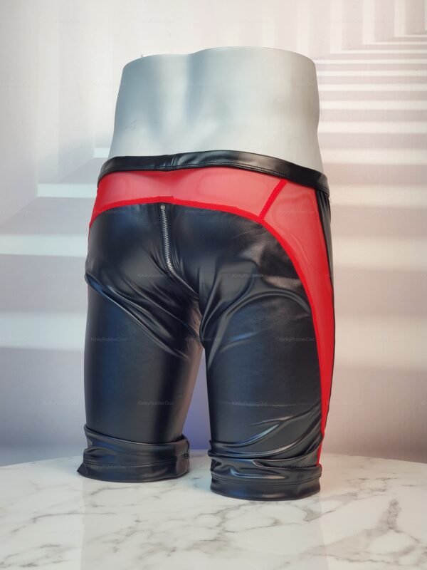 Black faux leather shorts with a front zipper and red mesh accents.
