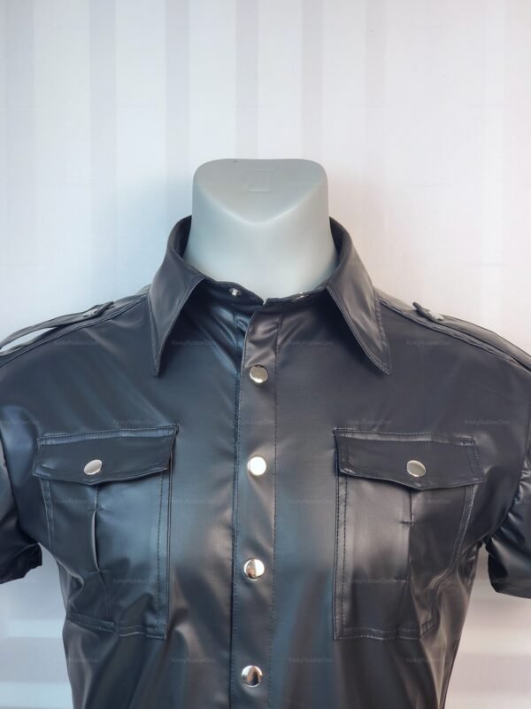 Sleek black faux leather shirt with shiny silver buttons and front pockets.