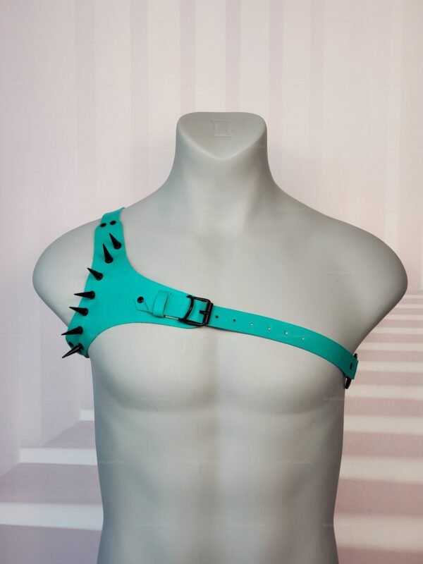 Teal latex harness with black spikes for men's fetish fashion.