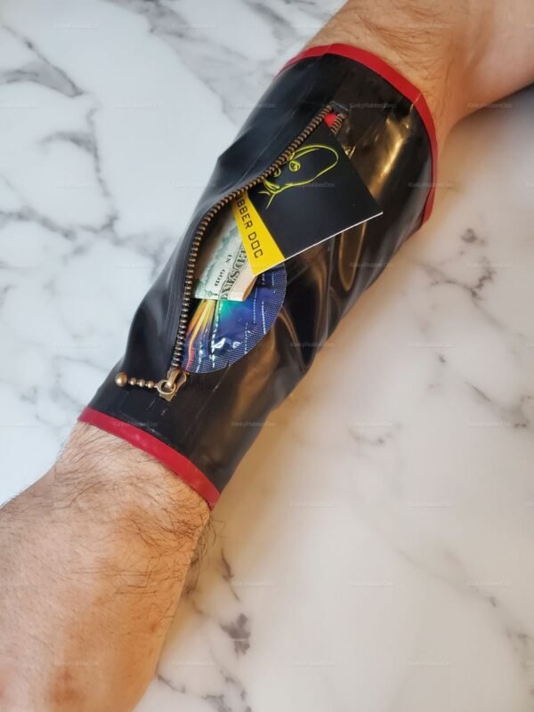 Unisex latex wrist wallet with zipper closure and vibrant red accents.