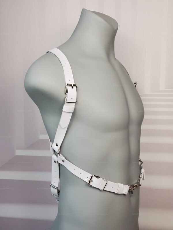 White leather body harness with adjustable straps and metal buckles, designed for fetish fashion.
