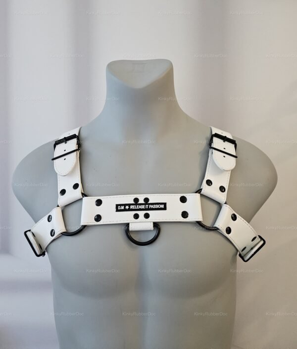 White unisex harness with black buckle accents and adjustable straps.