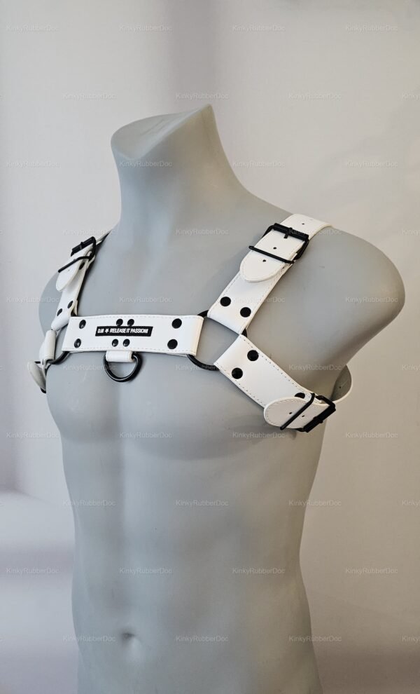 White vegan leather harness with black hardware and adjustable straps.