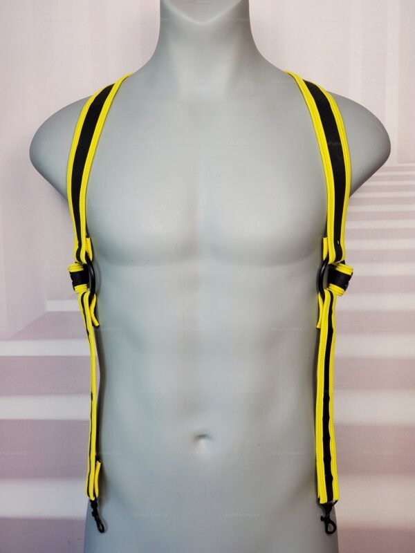 Close-up of a yellow and black suspenders harness with adjustable straps.