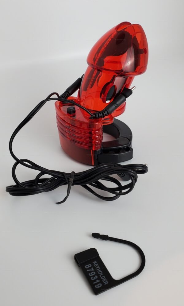 Red adjustable chastity cage with electro contact and black keyholder for intimate exploration.