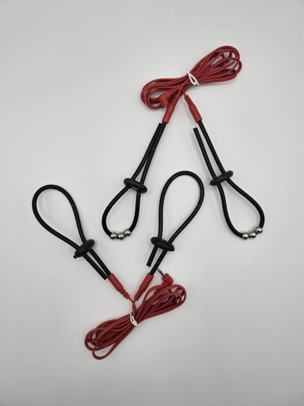 Adjustable electro penis loops with vibrant red cords and sleek black loops, designed for an electrifying kink experience.