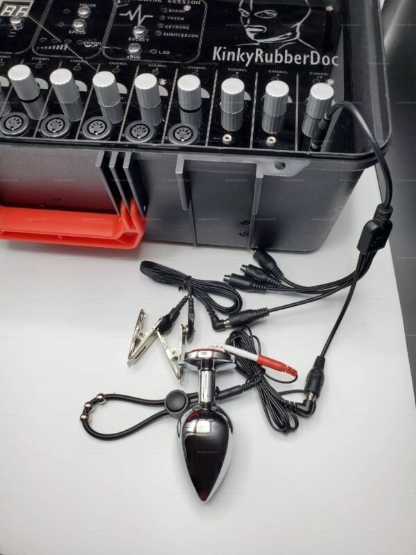 The Andronus BDSM Electro Kit with Keys, featuring a sleek control panel, adjustable dials, and various metallic accessories for an electrifying experience.
