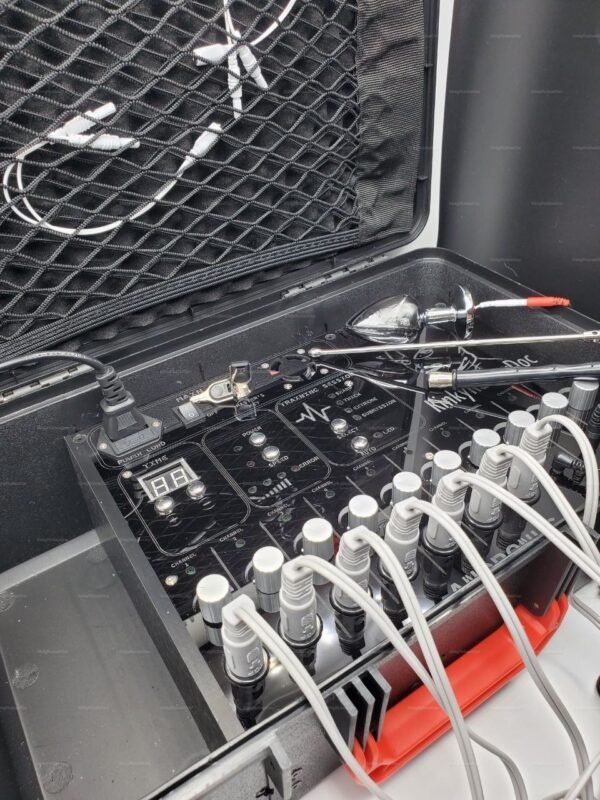 Andronus electrostimulation device setup featuring multiple cables and controls in a sleek black and silver design.