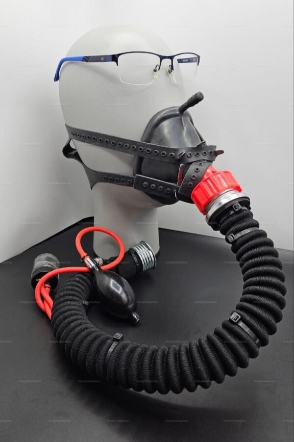 A rubber half mask with intricate straps and attached hoses, designed for a bold and adventurous look in the kink community.