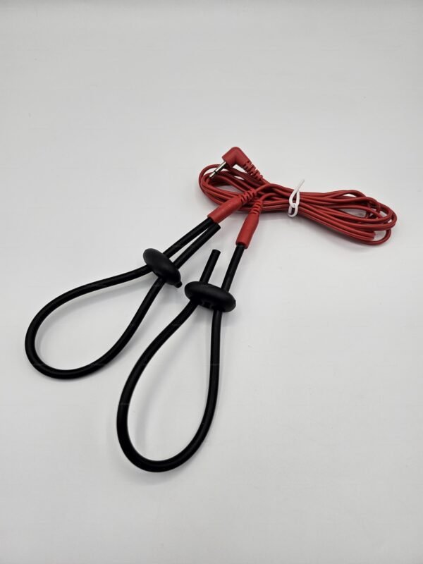 Black electro straps with red connectors designed for BDSM play.