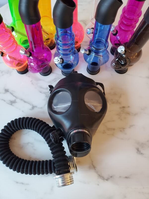 Black skull pipe hookah attachment with a sleek, dark gas mask and colorful pipes in the background.