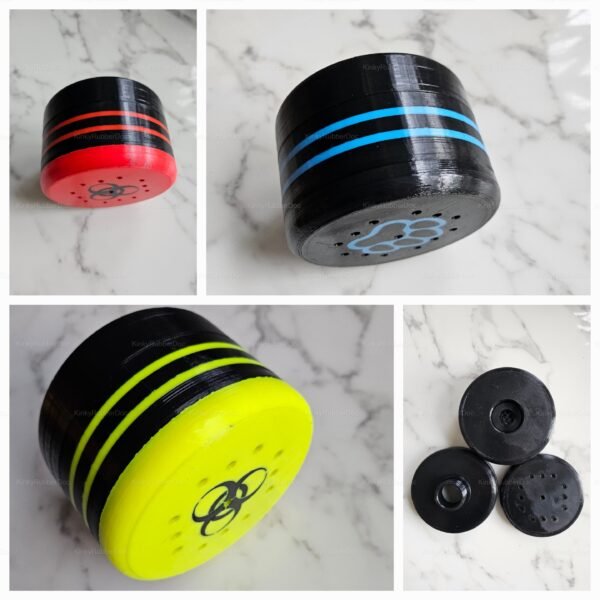 A collection of black sniffing canisters with customizable lids, featuring vibrant red, blue, and yellow accents, set on a marble surface.