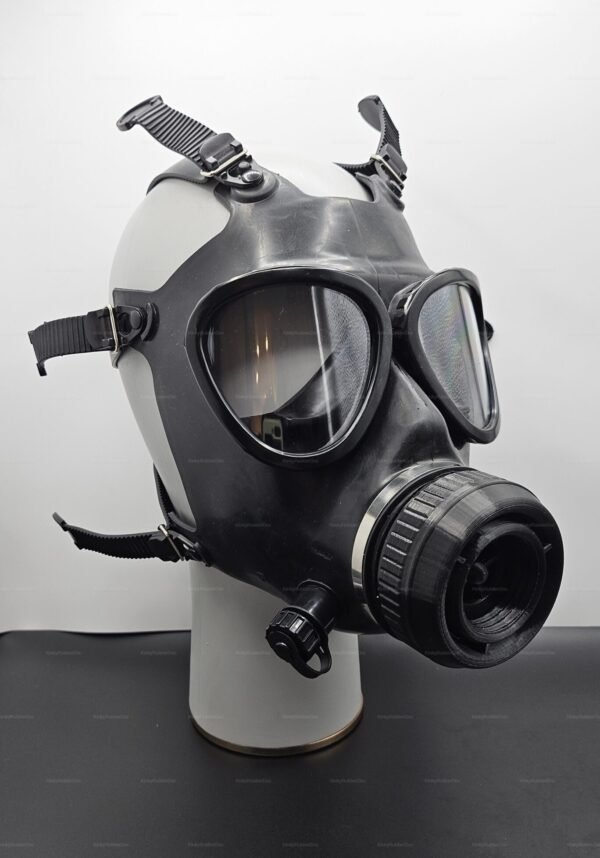 Black gas mask with adjustable straps and a drinking connection port, designed for a unique and edgy look.