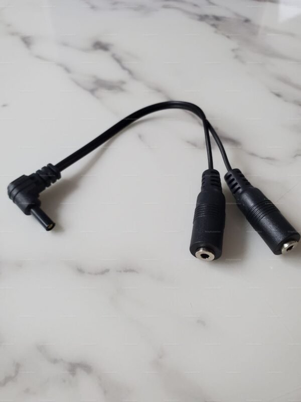 DC 2.5mm TENS Adapter Electro-Fetish Cable on a marble surface.