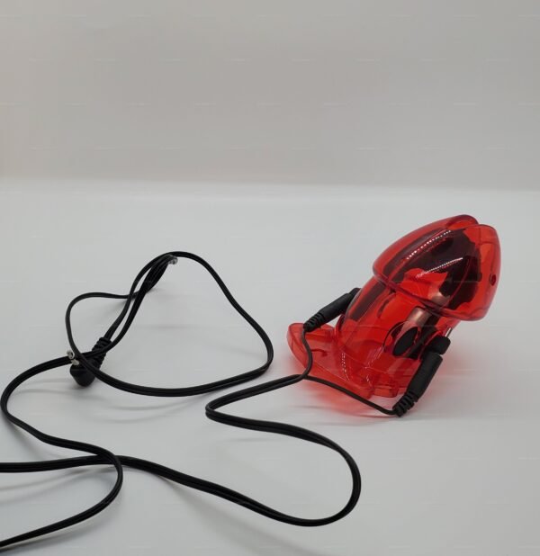Red e-stim chastity cage designed for male submission with attached wires for electric stimulation.