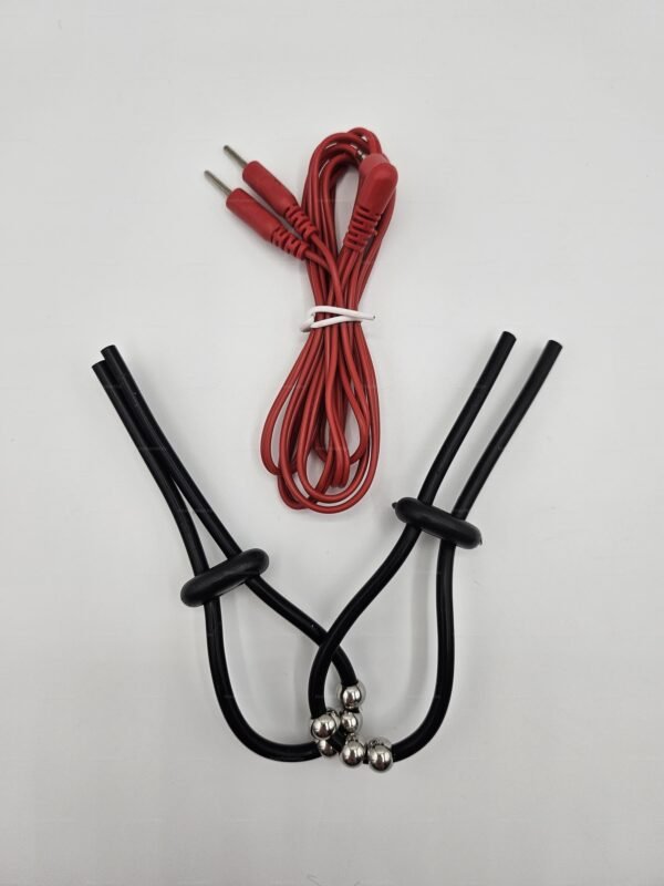 E-stim cock rings with beads featuring black adjustable loops and silver beads, accompanied by a red connecting wire.