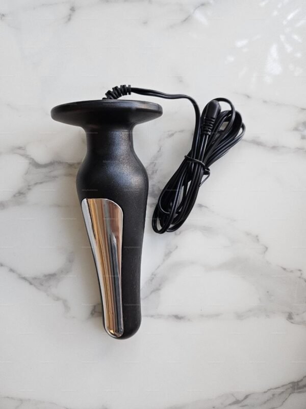 e stim electro plug with fixed cable and sleek metal strips on a marble surface.