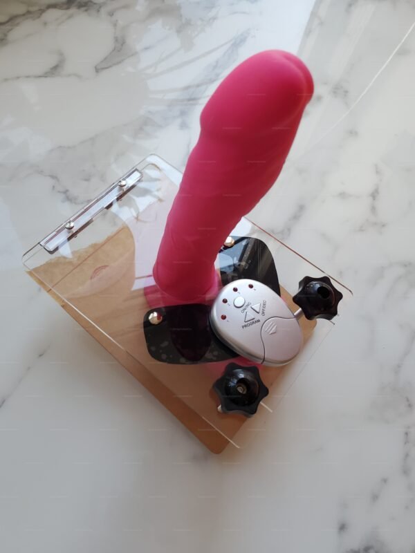 Electro Ball Crusher – CBT Plate with E-Stim Control. Electro CBT Ball Press Acrylic Board with a sleek, transparent design and vibrant pink attachment.
