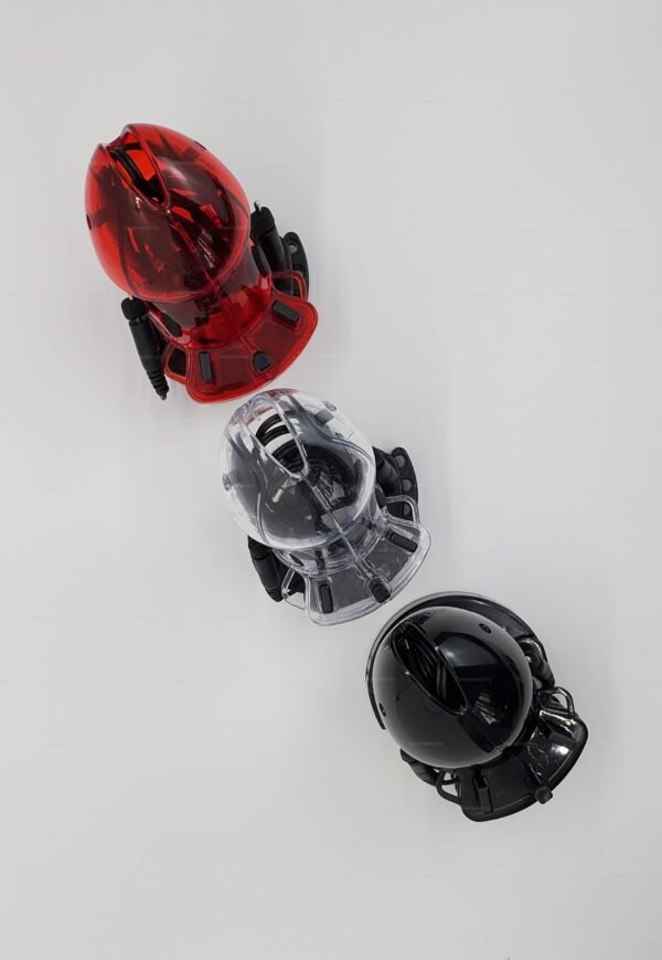 Three electro-chastity cages in red, clear, and black, showcasing sleek designs and modern materials.