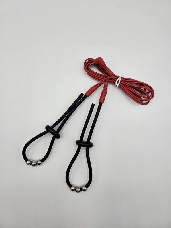 Electro-penis-strap-stimulation-toy with sleek black loops and vibrant red cords for sensual electro-play.