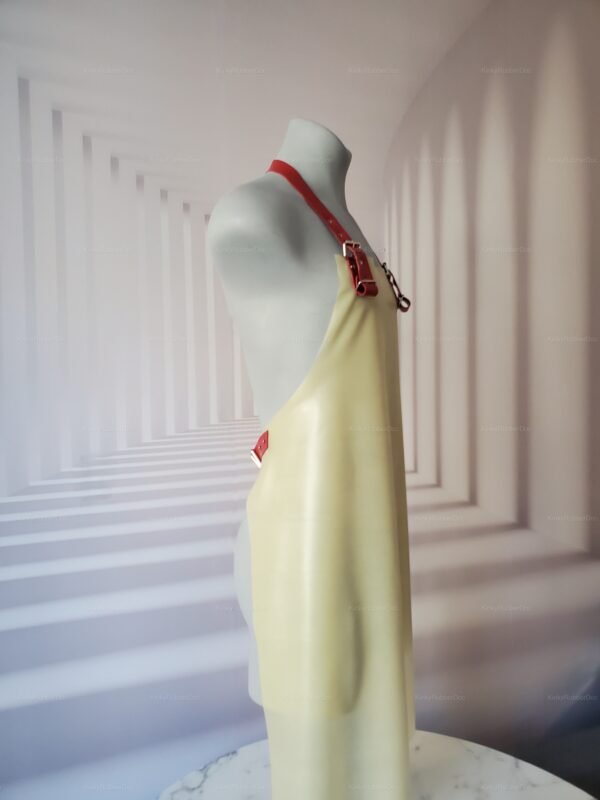 Latex apron with red straps, designed for a fetish cooking experience.