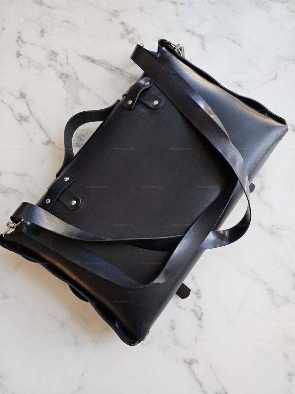 Sleek black rubber office bag with fetish-inspired design, featuring smooth textures and a bold aesthetic.