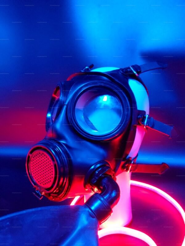 A sleek black gas mask with a modern design, enhanced by vibrant red and blue lighting, creating a bold and edgy look.