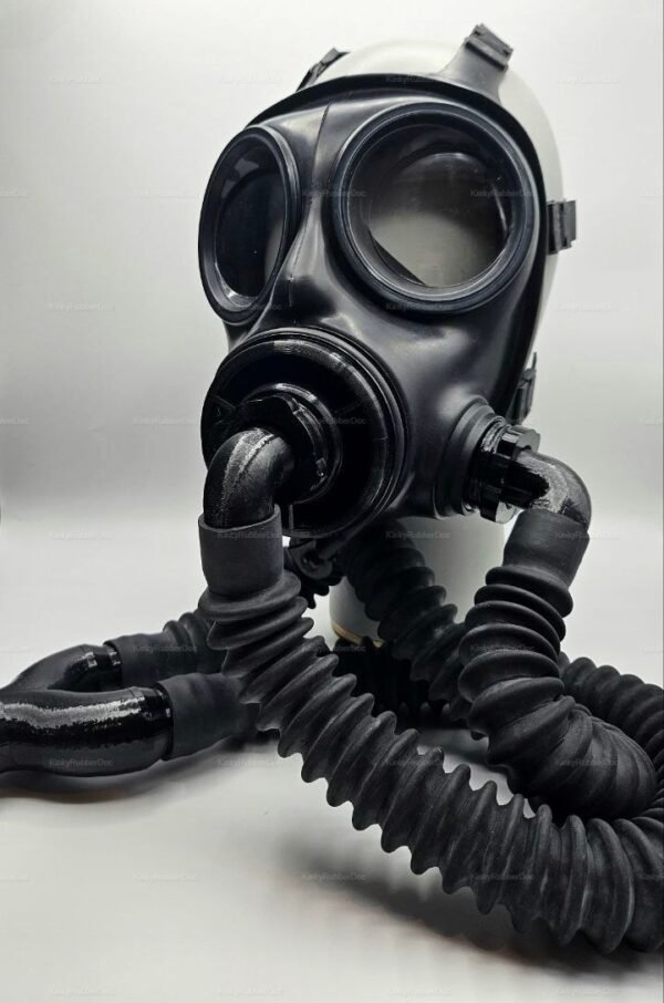 A sleek, black gas mask with dual hose and threaded front, designed for a bold and edgy look.