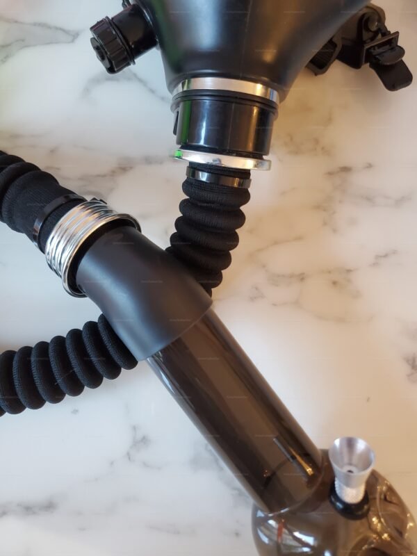 Sleek black gas mask with flexible tubing, part of a unique pipe hookah kit collection on a marble surface.