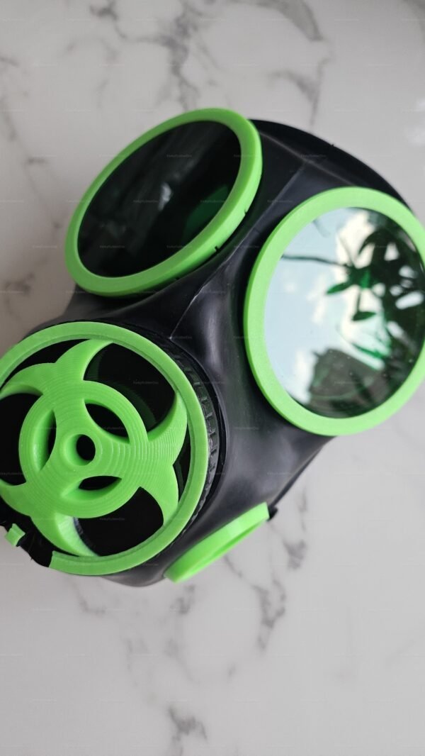 Green biohazard-themed gas mask with striking neon accents, designed for fetish fashion by KinkyRubberDoc.