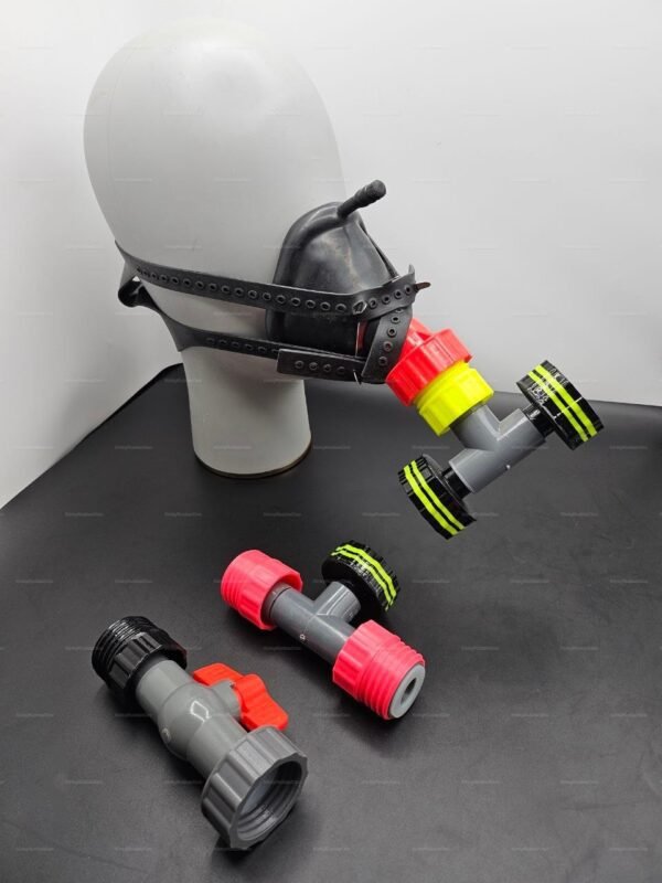 A black half-mask with a red pump attachment and adjustable straps, designed for sensory play.