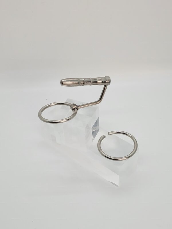 Sleek metallic kinky penis plug with glans hook, designed for adventurous exploration.