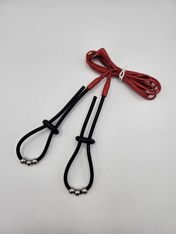 kinkyrubberdoc electro cock loops featuring sleek black cords, metallic accents, and a vibrant red cable for an electrifying experience.